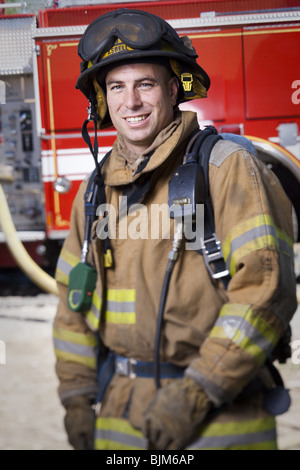 Fire fighter in uniform with Crossed Arms Stock Photo