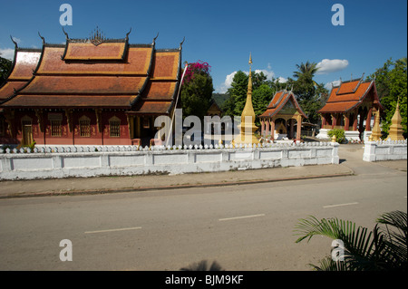 The temple complex buildings of Wat Saen Luang Prabang Laos seen from across the road Stock Photo