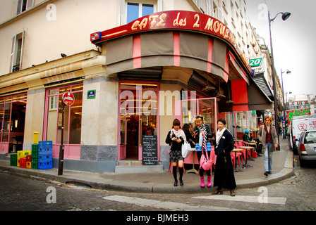 Japanese tourists at Cafe des 2 Moulins famous for Amelie film Paris France Stock Photo