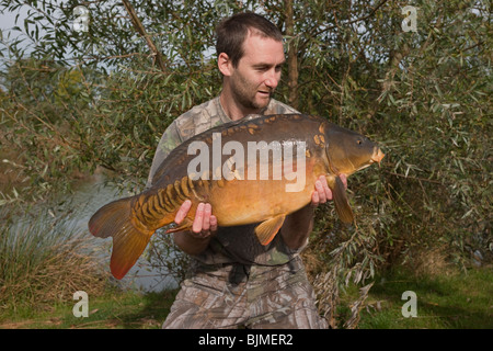 mirror carp caught at the cotswold water park, UK. Using homemade boilies Stock Photo