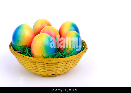 Colorful Easter basket with colorful, dyed Easter eggs Stock Photo