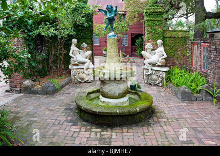 St. Augustine, FL - Jan 2009 - Quaint brick paved courtyard with sculptures and fountain in St. Augustine, Florida Stock Photo