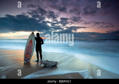 Surfer in the evening sun on the beach of Westerland, winter, island of Sylt, Schleswig-Holstein, Germany, Europe Stock Photo