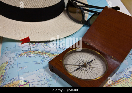 Planning a trip to the Caribbean, Cuba, historical compass and shades Stock Photo