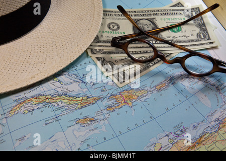 Planning a trip to the Caribbean, Cuba, historical reading glasses, U.S. Dollar Stock Photo