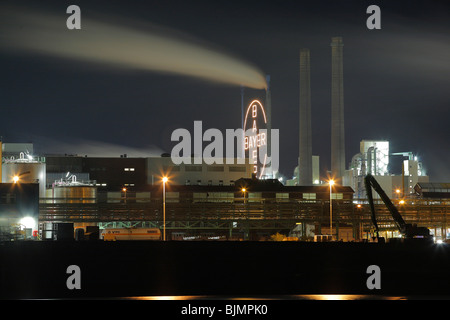 Bayer factory buildings and premises with the Rhine river in the foreground, night shot, Leverkusen, North Rhine-Westphalia, Ge Stock Photo