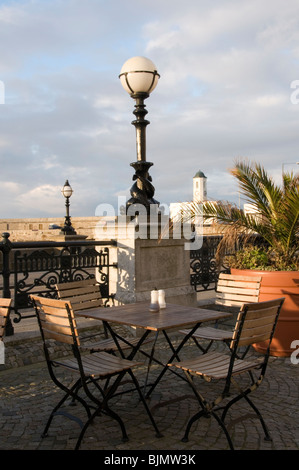 Tables outside a fish and chip shop on Margate sea-front Stock Photo