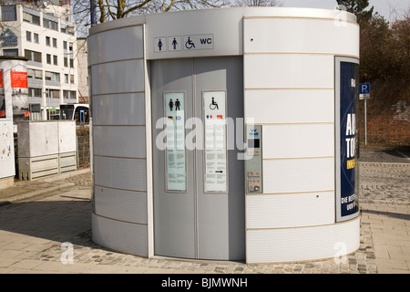 A modern pay-per-use public toilet (City Toilette) stands in the historic city of Ulm, Germany. Stock Photo