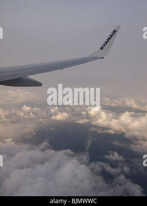 Boeing 737-800 wingtip Ryanair over cloudy Europe Stock Photo