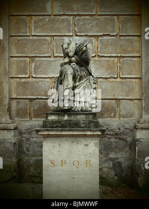 Ancient Roman statue with SPQR inscription Senatus Populus Que Romanum The Senate and the People of Rome. Stock Photo