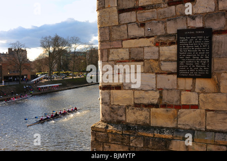 YORK, UK - MARCH 13, 2010:  Racing Boat passing Lendal Tower on River Ouse in York Stock Photo