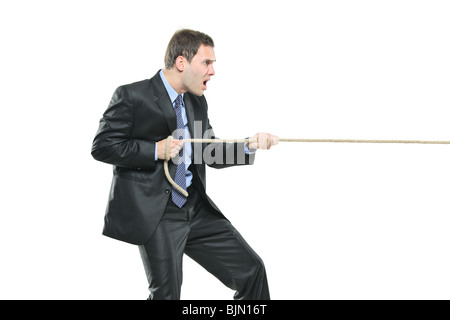 A young businessman pulling a rope isolated on white background Stock Photo