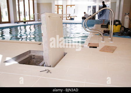 Maintenance work being done on a swimming pool. Stock Photo