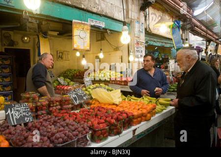 Vendors in Mahane or Machane Yehuda market often referred to as 'The Shuk', an open-air, marketplace in West Jerusalem, Israel Stock Photo