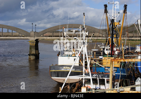 Scallop fishing fleet, Kirkcudbright Harbour, Scotland. Dee Bridge in background Stock Photo