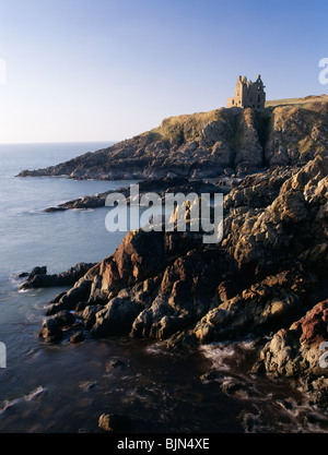 Dunskey Castle high on the cliffs above the sea looking up the North Channel to Ireland near Portpatrick Galloway Scotland UK Stock Photo