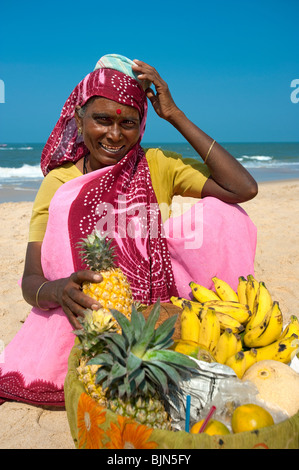 Local Fruit seller on beach, Calangute, Goa, India Stock Photo