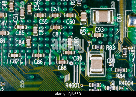 close up photograph of electronic components on a computer mother board Stock Photo