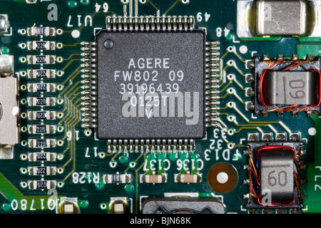 close up photograph of electronic components on a computer mother board Stock Photo