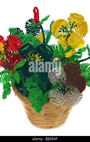 Handmade article: vase with flowers from glass beads and wire. Yellow, blue, pink, white bud. Green foliage. Isolated over white Stock Photo