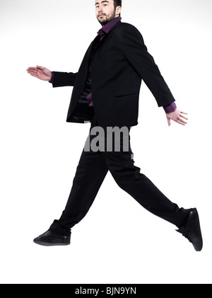 strange man on studio isolated white background jumping running Stock Photo