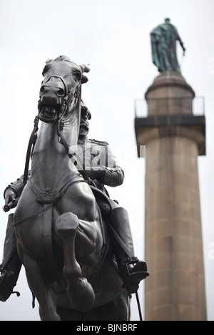 Equestrian bronze statue to King Edward VII by Sir Bertram MacKennal with the Duke Of York column behind in London Stock Photo