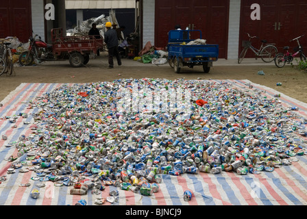 Used tin cans waiting for recycling . Hubei province. China. Stock Photo