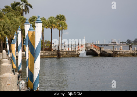Venetian Mooring Poles and bridge in the Bay of Biscayne, Villa Vizcaya Miami Florida Stock Photo