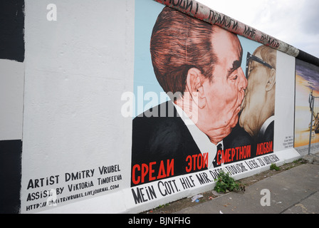 Eastside Gallery, Mortal Kiss or Kiss of Death, painting on the remaining part of the Berlin Wall, Berlin, Germany, Europe. Stock Photo