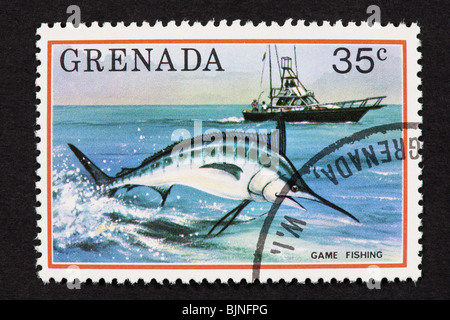 Postage stamp from Grenada depicting game fishing. Stock Photo