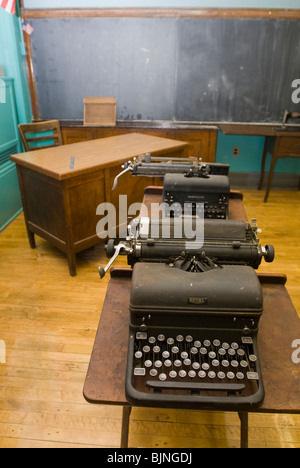 Old manual typewriters are seen in an unused classroom in a school in New York Stock Photo