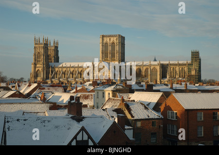 York Minster across the rooftops in winter, York, England, UK Stock Photo