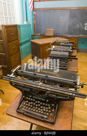 Old manual typewriters are seen in an unused classroom in a school in New York Stock Photo
