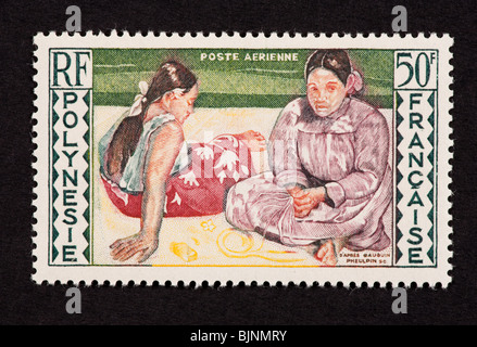 Postage stamp from French Polynesia depicting the Guaguin painting 'Women of Tahiti'. Stock Photo