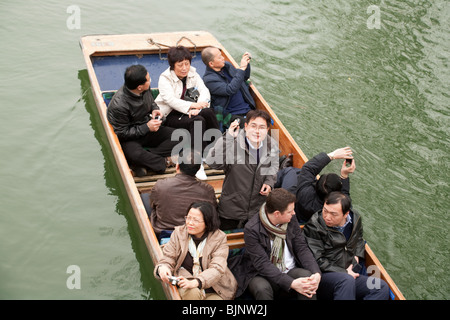 Japanese tourists in a punt, River Cam, Cambridge UK
