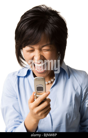 Woman with cell phone shouting Stock Photo
