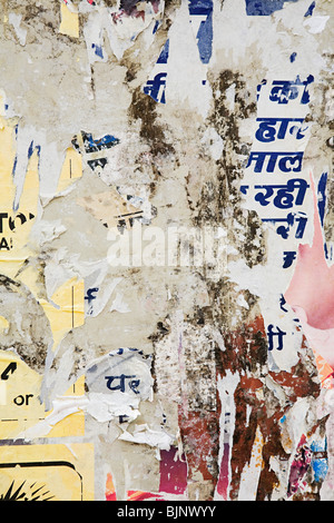 Torn posters on a wall Stock Photo