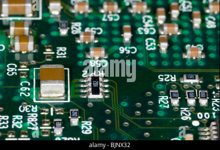 close up photograph of electronic components on a computer mother board Stock Photo