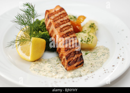 Grilled salmon served in restaurant Stock Photo