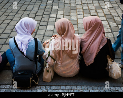 Women in scarves looking down at camera Stock Photo