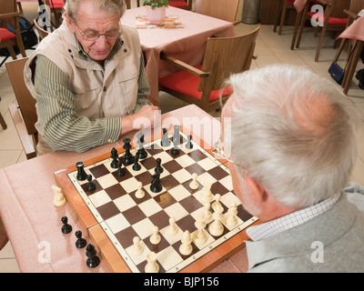 Senior men playing chess Stock Photo