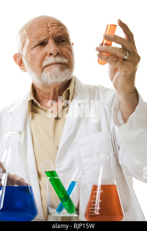 Scientist with chemicals in test tubes and beakers Stock Photo