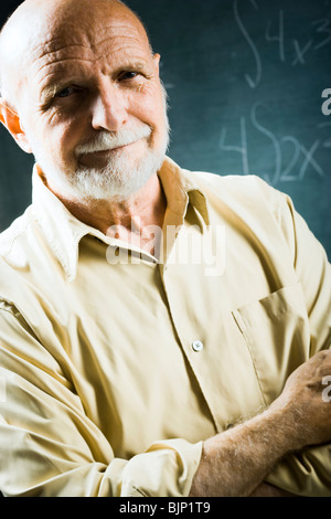 Closeup of male school teacher holding chalk Stock Photo