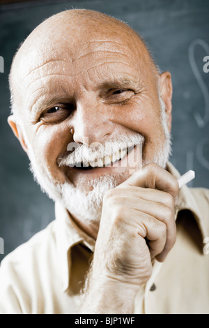 Male school teacher laughing Stock Photo