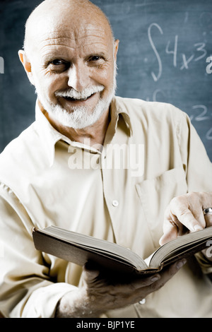 Male school teacher with book Stock Photo