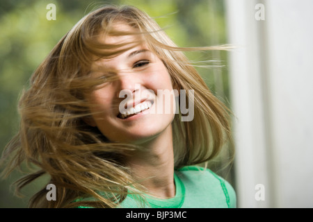 Closeup of woman swinging hair Stock Photo