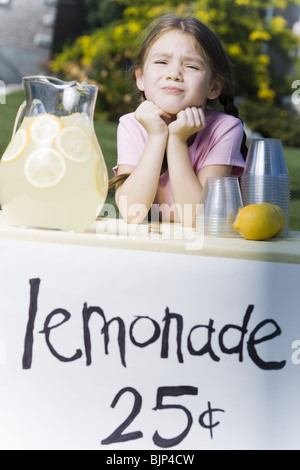 Girl selling lemonade Stock Photo