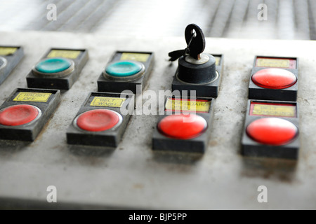 on button on machine with key Stock Photo