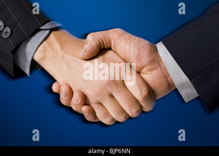 Two hands shaking Stock Photo