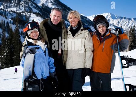 A family on a snowy mountain Stock Photo